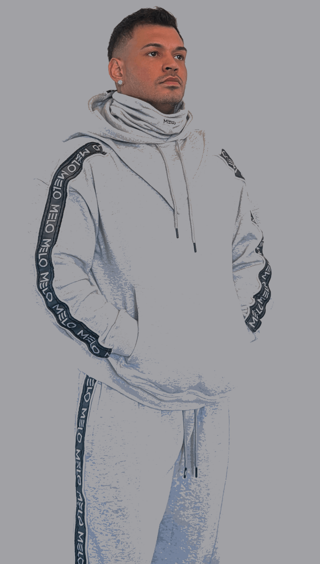 Model wearing the GOAT SWEATSUIT🐐 featuring a boxy sweater and loose wide-leg pants in gray.